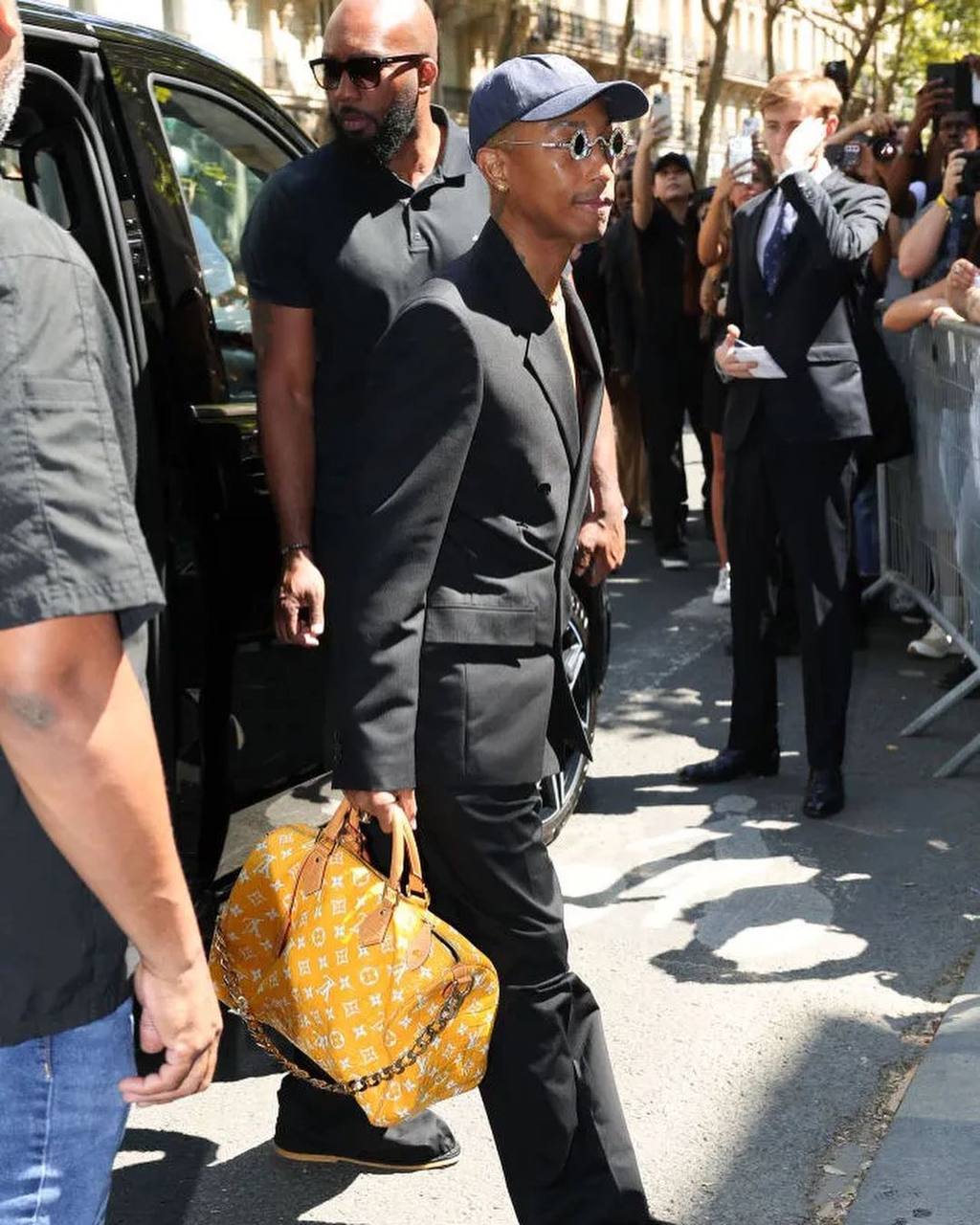 Pharrell Williams admires the most expensive LV bag ever